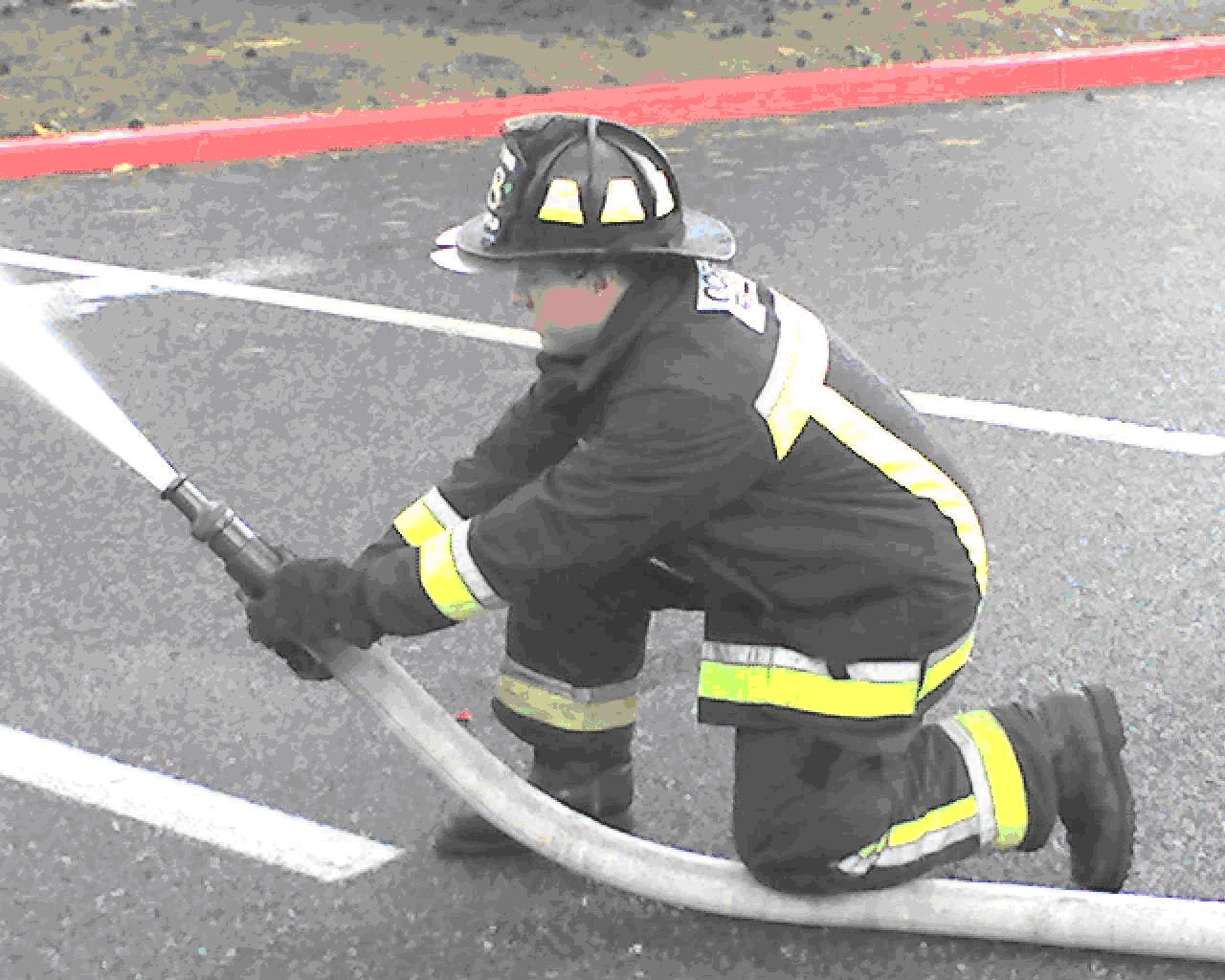 Single firefighter/hose pinned with knee